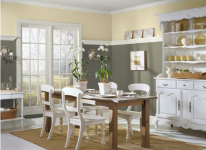 Benjamin Moore's Soleil lifts the mood atop of grey Sparrow and creates sunny harmony in this dining room.